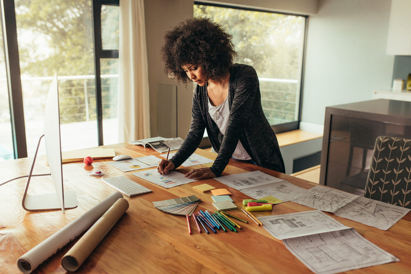 Woman Drawing a Graph on a Paper 